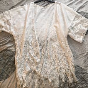 Whimsical lace cardigan with fringe detail